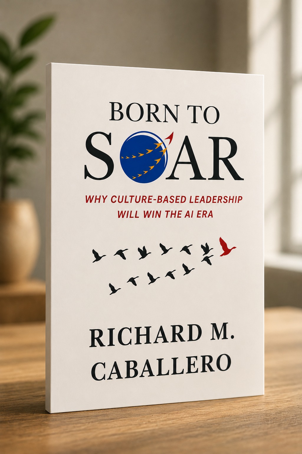Born to Soar by Richard M. Caballero, standing on a wooden desk