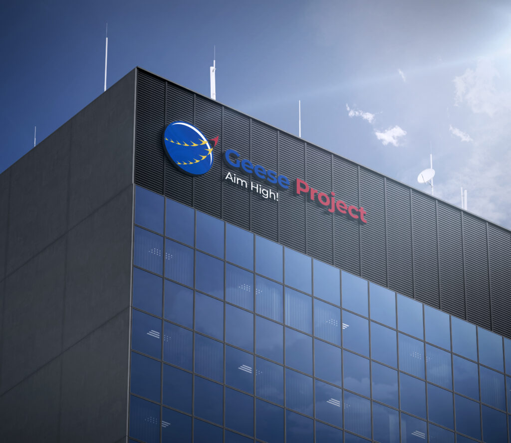Geese Project sign mounted on the exterior of a modern office building