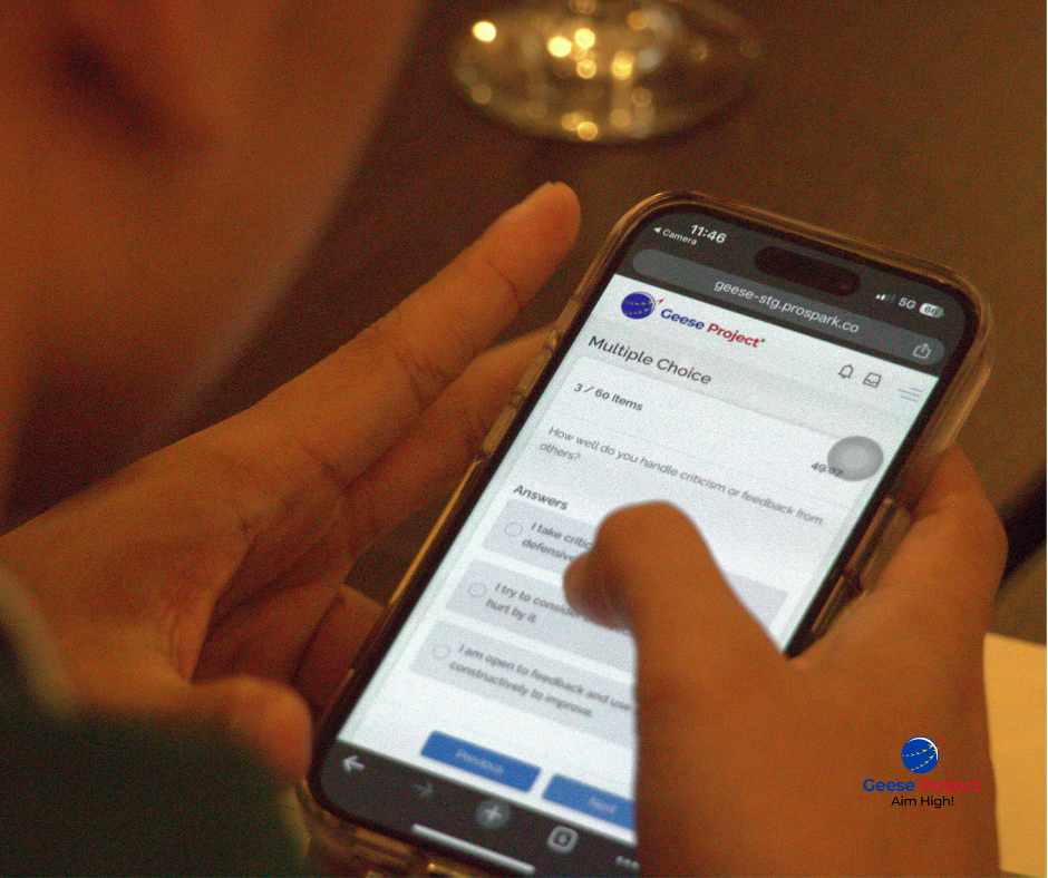 Workshop participant viewing the Geese Project leadership assessment on a phone